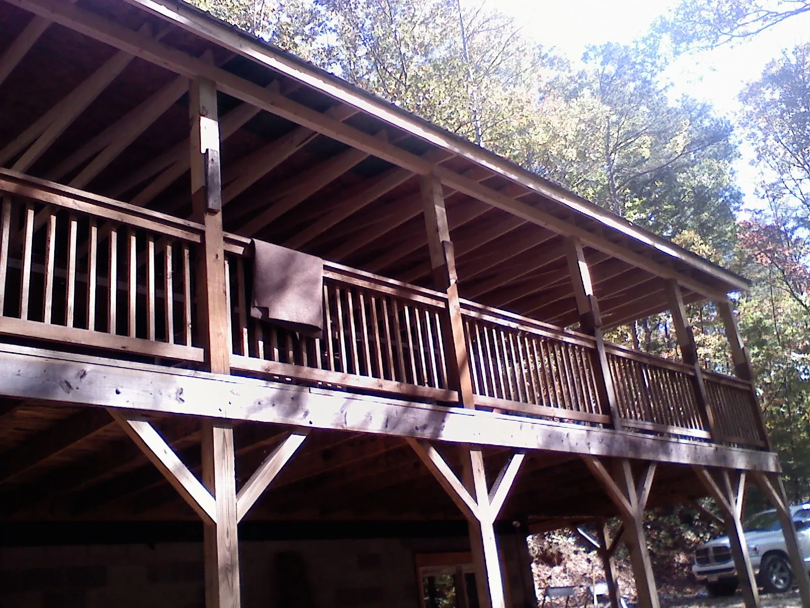Timber framing under a new elevated porch and deck — Roof Leak Repair in Commerce by Roofing Brothers